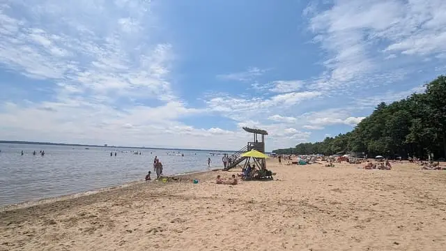 The sandy beach and swimming area at Oka national park.