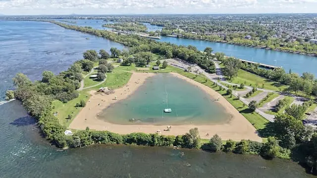 An aerial view of the RécréoParc beach and its enclosed swimming lagoon.
