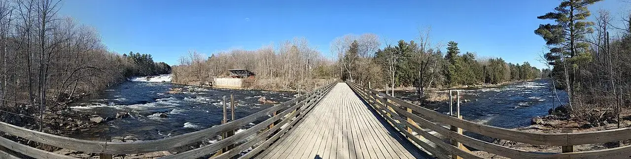 A panoramic view from the bridge over Wilson Falls in early spring.